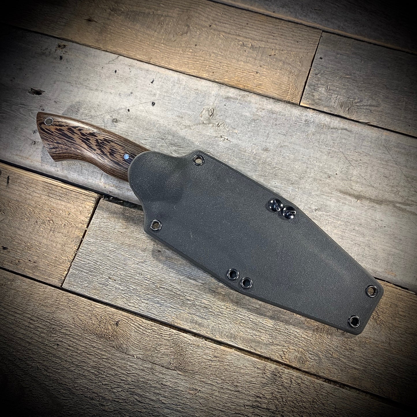 Hand Forged 1095 High Carbon Steel Hunting Knife, handmade in Winnipeg Canada by Blacksmith Graeson Fehr. Kydex or hand tooled leather sheath options.