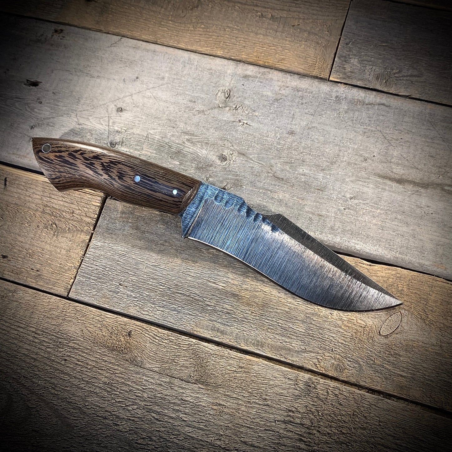 Hand Forged 1095 High Carbon Steel Hunting Knife, handmade in Winnipeg Canada by Blacksmith Graeson Fehr. Kydex or hand tooled leather sheath options.