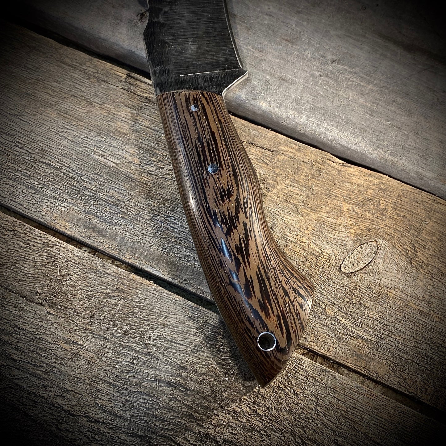 Hand Forged 1095 High Carbon Steel Hunting Knife, handmade in Winnipeg Canada by Blacksmith Graeson Fehr. Kydex or hand tooled leather sheath options.