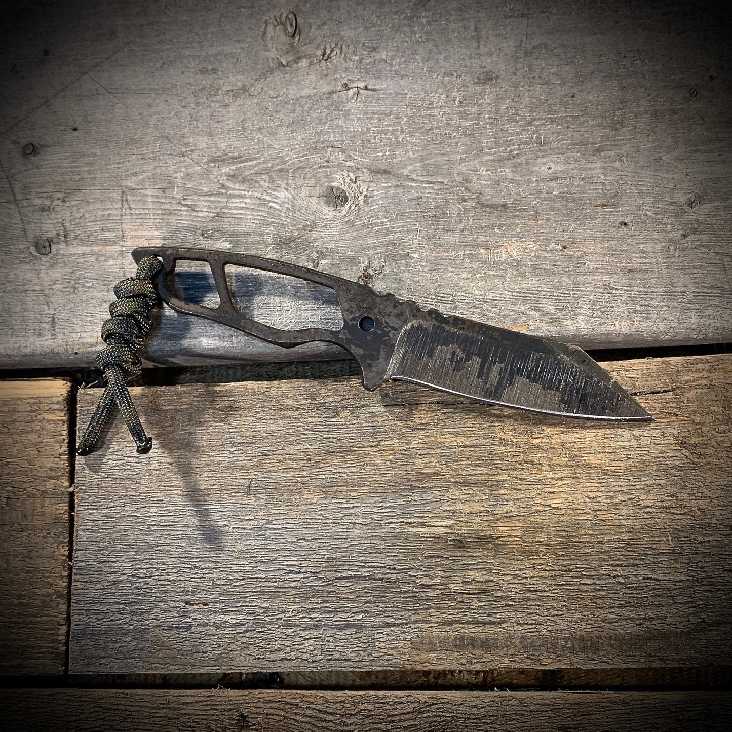 Hand Forged 1095 High Carbon Steel Neck Knife, perfect for Hiking and Bushcraft. Handmade by blacksmith Graeson Fehr In Winnipeg Manitoba Canada. Perfect for hiking, with durable black finish and paracord handle wrap.