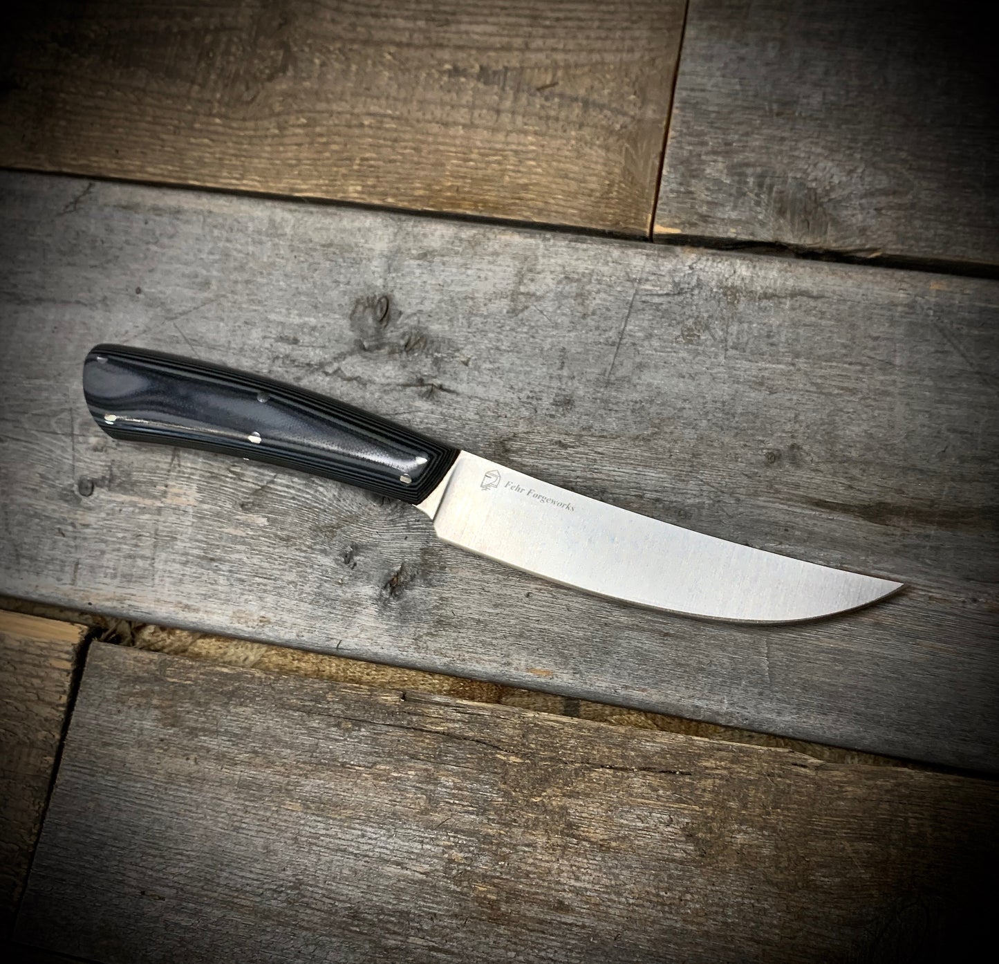 Hand Forged 1095 High Carbon Steel Hunting Knife, handmade in Winnipeg Canada by Blacksmith Graeson Fehr. Kydex or hand tooled leather sheath options.