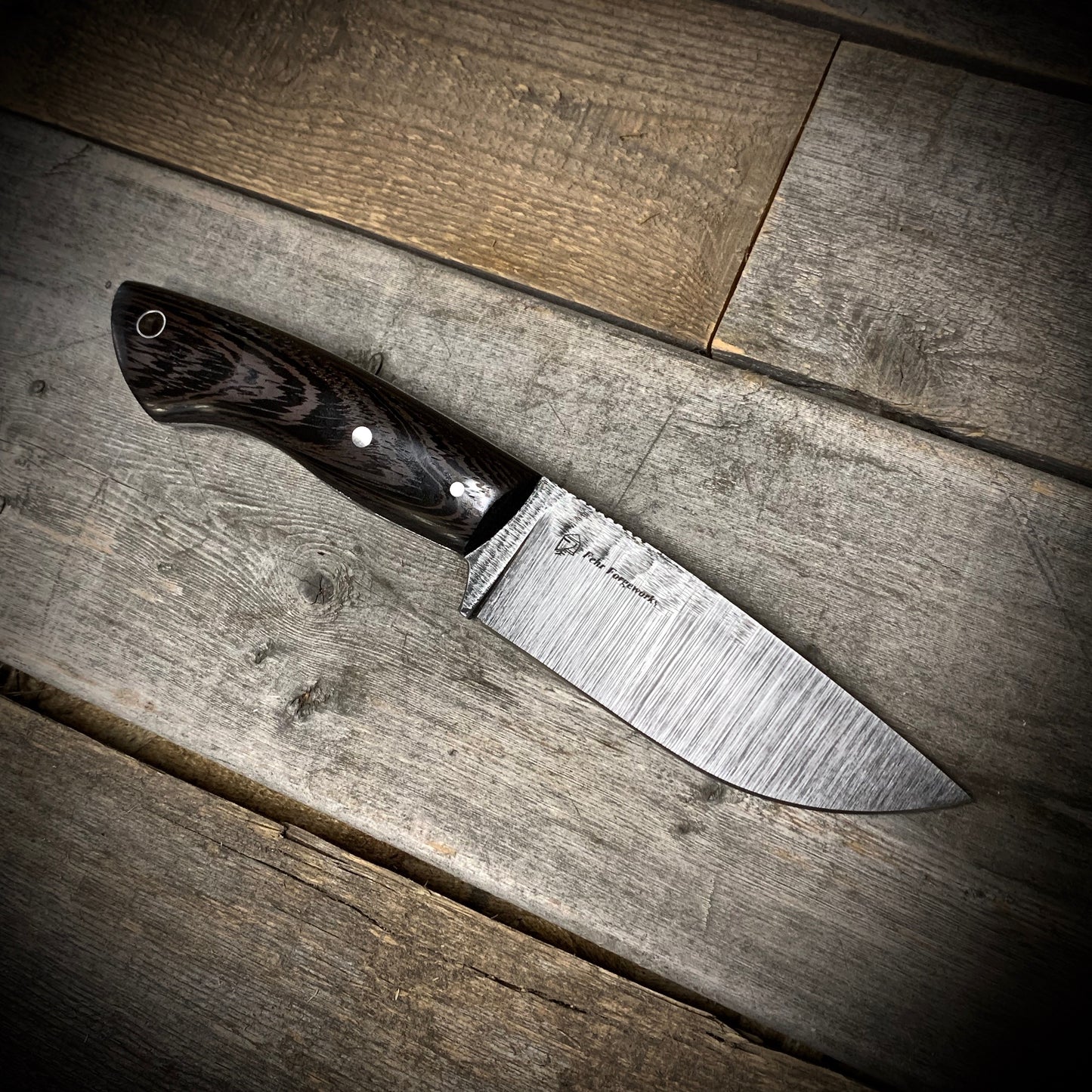 Hand Forged 1095 High Carbon Steel Hunting Knife, handmade in Winnipeg Canada by Blacksmith Graeson Fehr. Kydex or hand tooled leather sheath options.