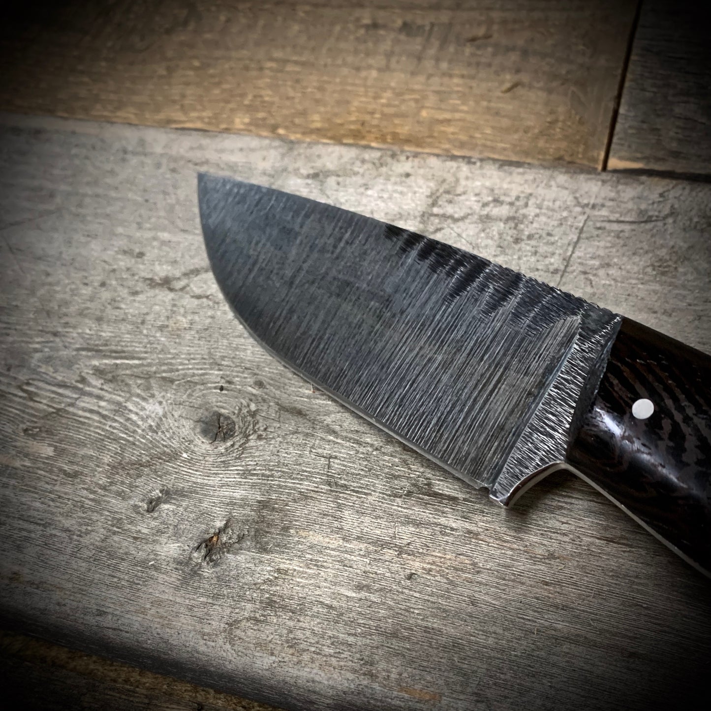 Hand Forged 1095 High Carbon Steel Hunting Knife, handmade in Winnipeg Canada by Blacksmith Graeson Fehr. Kydex or hand tooled leather sheath options.