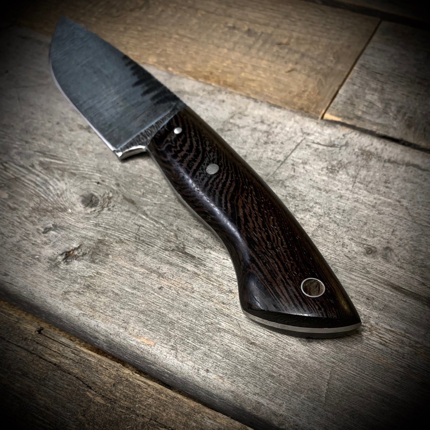 Hand Forged 1095 High Carbon Steel Hunting Knife, handmade in Winnipeg Canada by Blacksmith Graeson Fehr. Kydex or hand tooled leather sheath options.