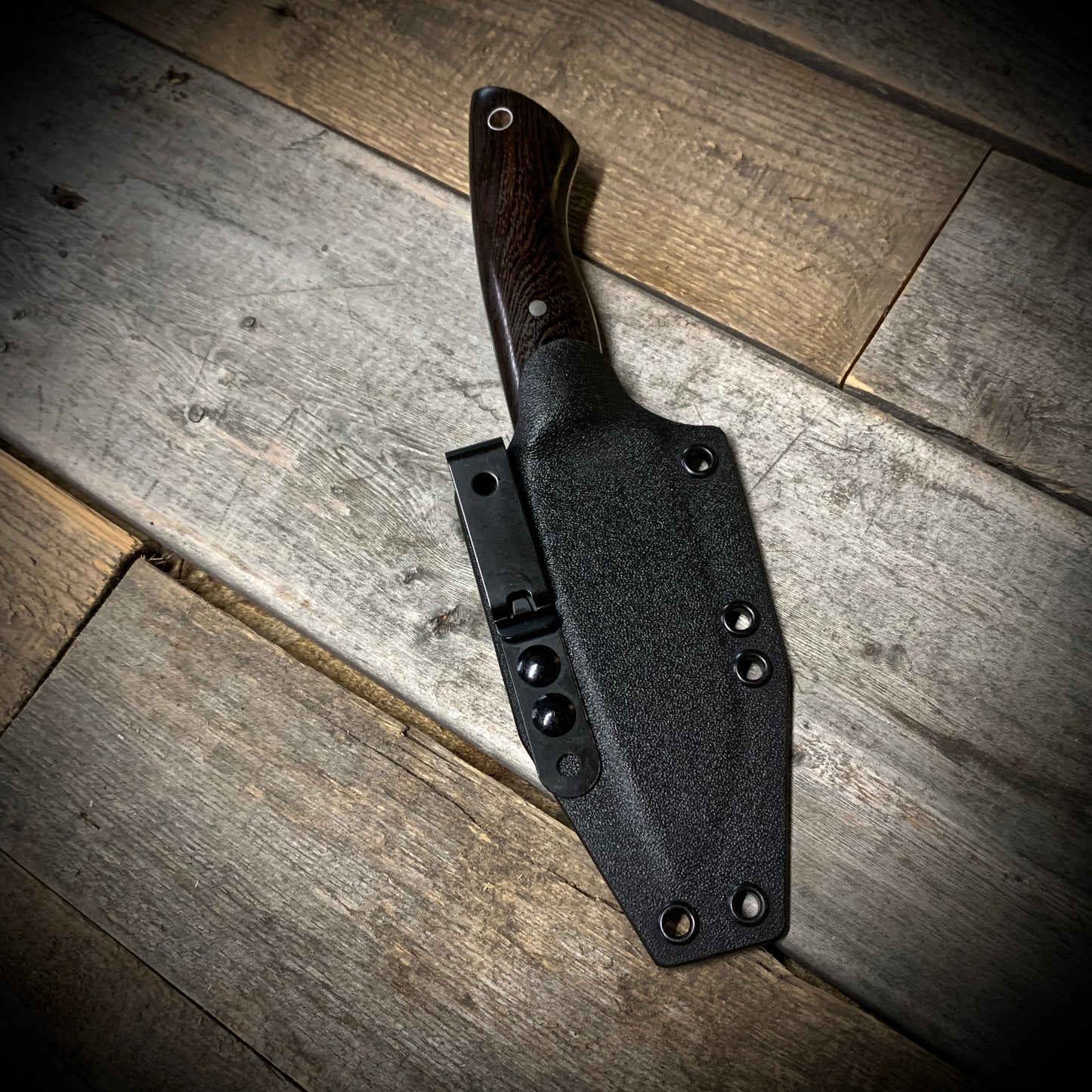 Hand Forged 1095 High Carbon Steel Hunting Knife, handmade in Winnipeg Canada by Blacksmith Graeson Fehr. Kydex or hand tooled leather sheath options.