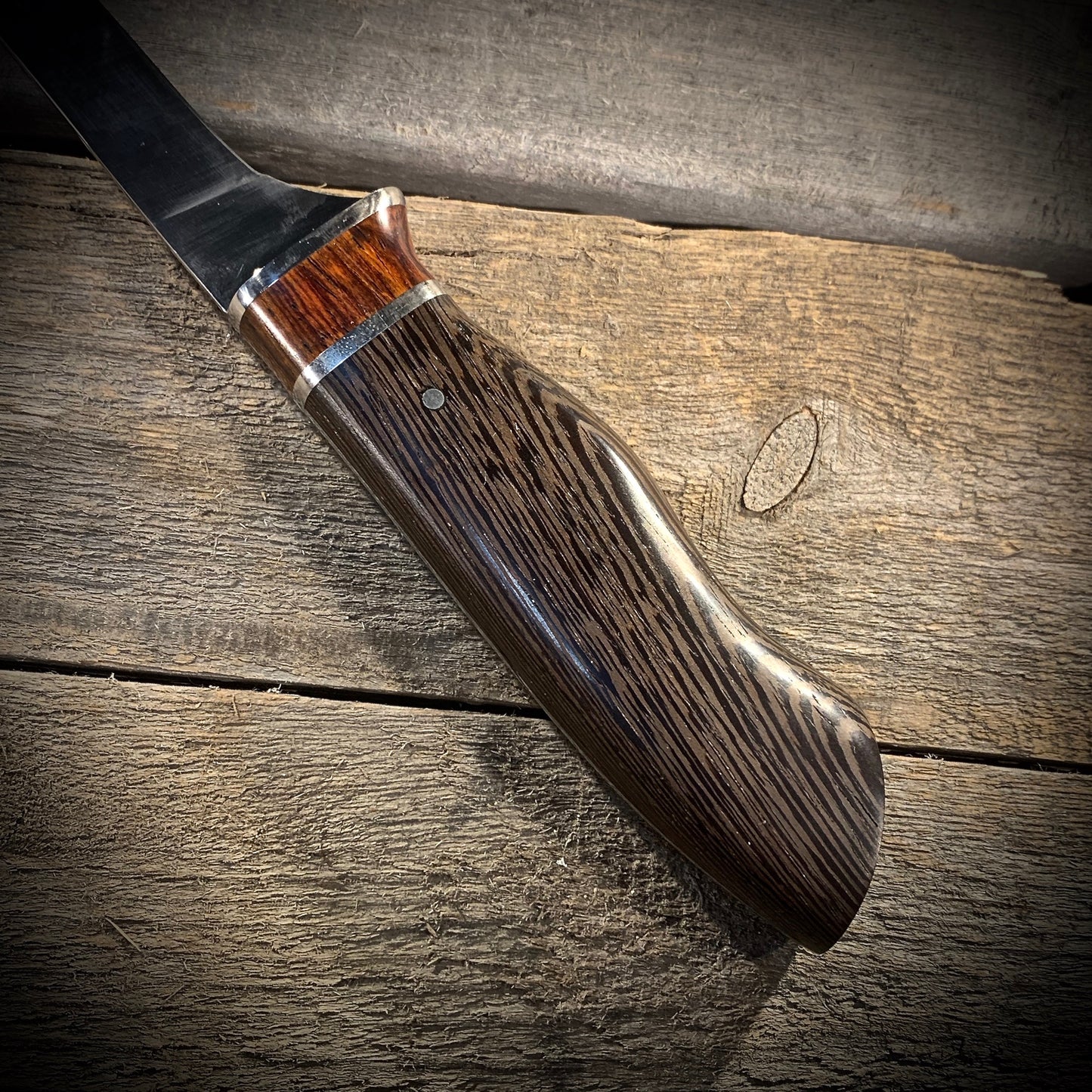 Hand Forged High Carbon Steel Filleting Knife. Designed for medium sized fish, with durable exotic wood handles. Handmade in Winnipeg Manitoba Canada