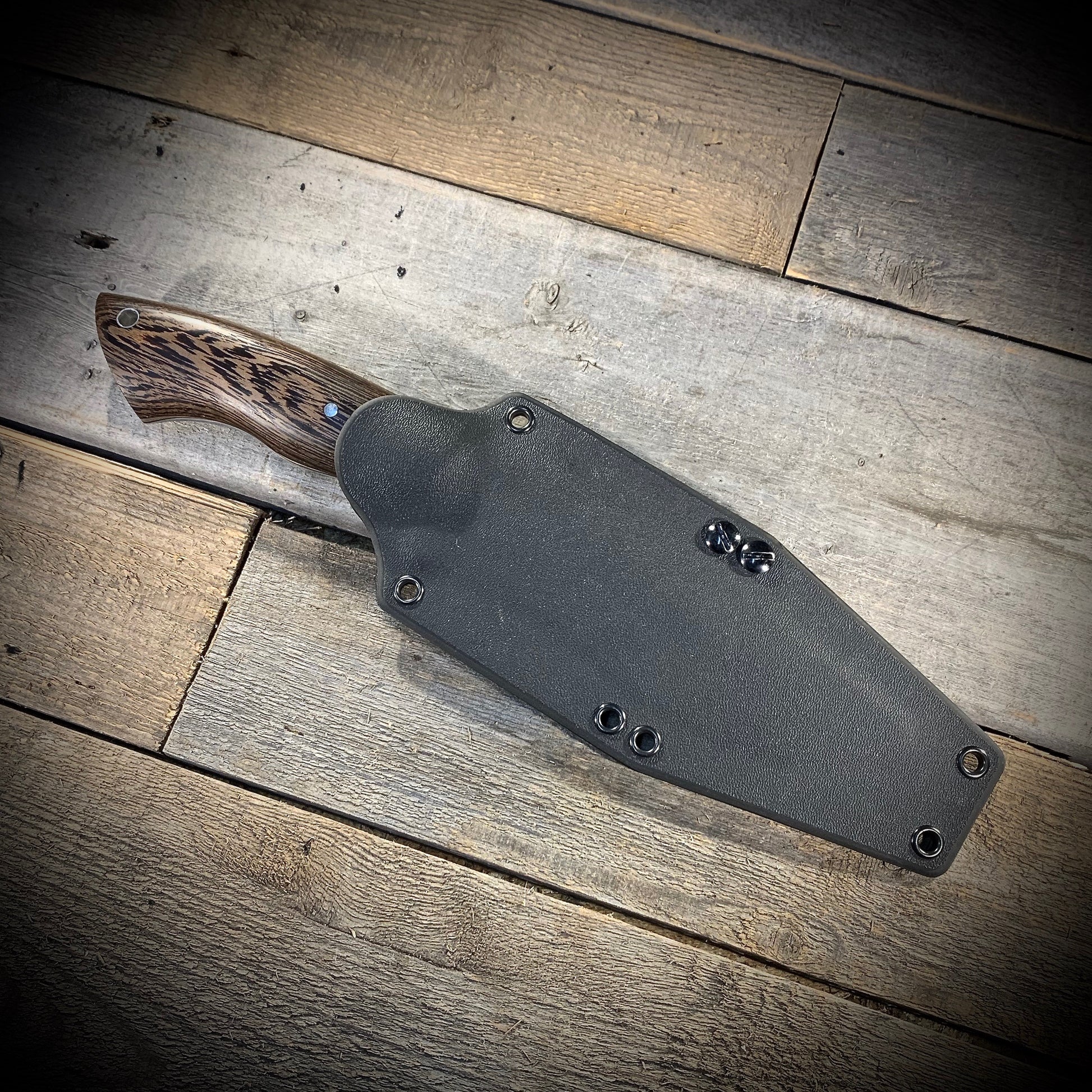 Hand Forged 1095  High Carbon Steel Hunting Knife, handmade in Winnipeg Canada by Blacksmith Graeson Fehr. Kydex or hand tooled leather sheath options.