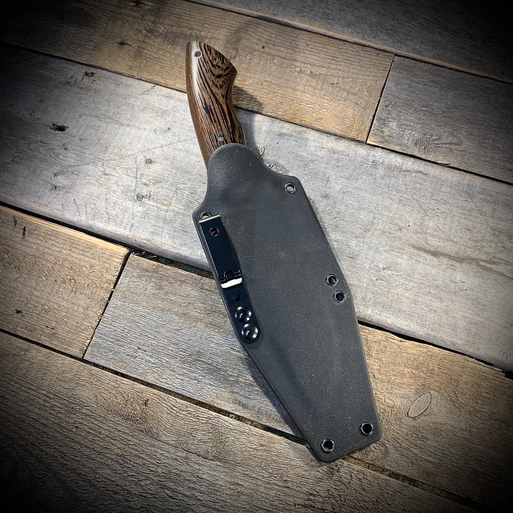 Hand Forged 1095  High Carbon Steel Hunting Knife, handmade in Winnipeg Canada by Blacksmith Graeson Fehr. Kydex or hand tooled leather sheath options.