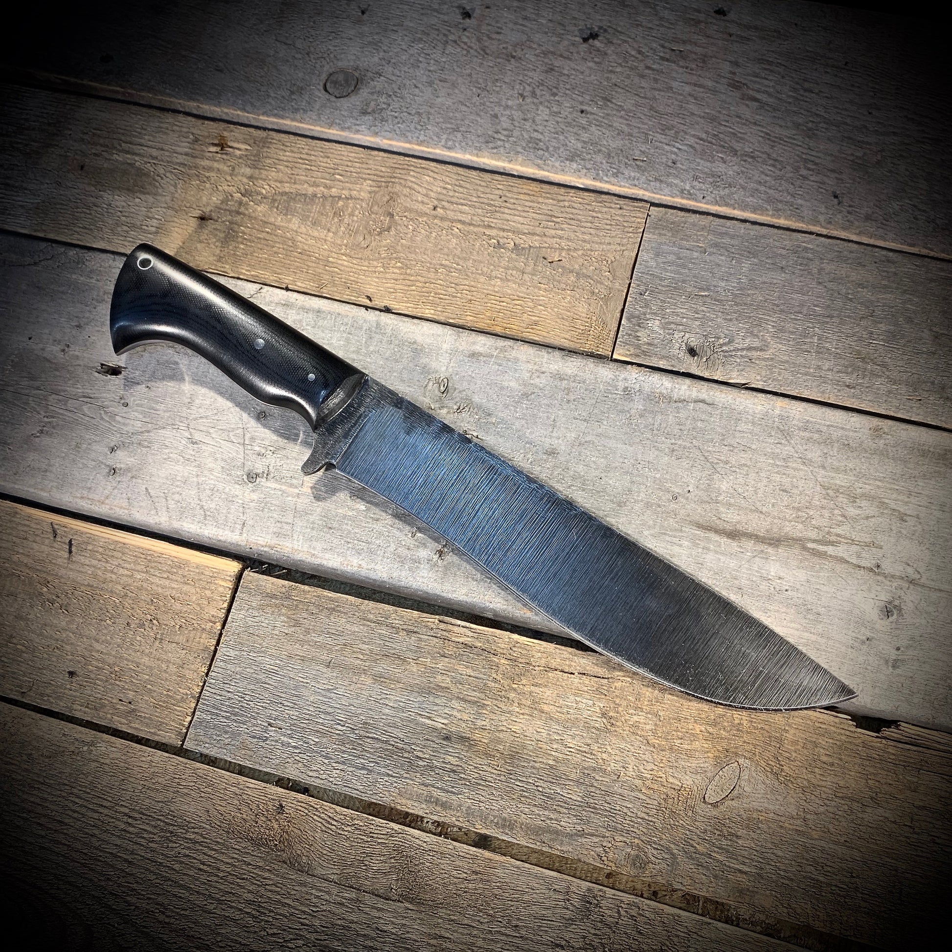 Hand Forged 1095  High Carbon Steel Hunting Knife, handmade in Winnipeg Canada by Blacksmith Graeson Fehr. Kydex or hand tooled leather sheath options.