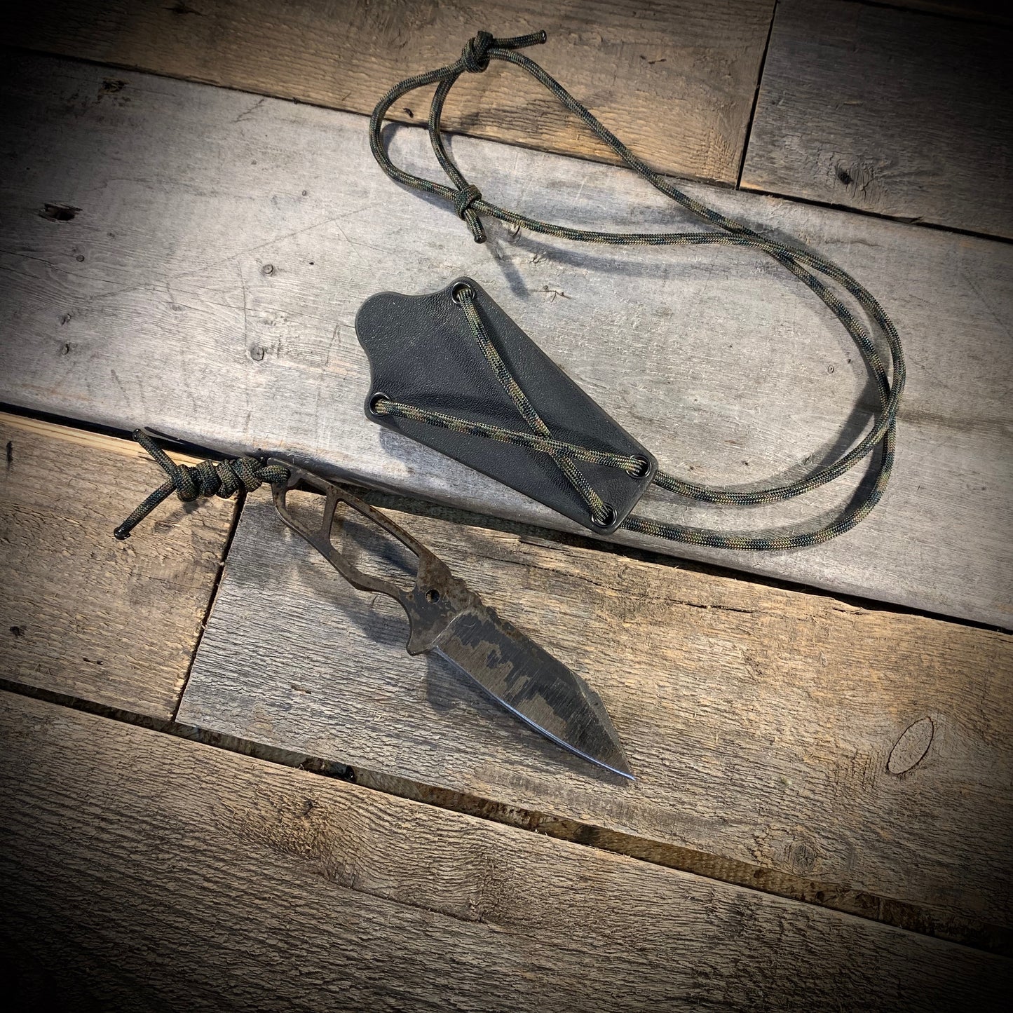 Hand Forged 1095  High Carbon Steel Neck Knife, perfect for Hiking and Bushcraft. Handmade by blacksmith Graeson Fehr In Winnipeg Manitoba Canada. Perfect for hiking, with durable black finish and paracord handle wrap. 