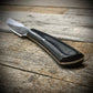 Hand Forged 1095  High Carbon Steel Hunting Knife, handmade in Winnipeg Canada by Blacksmith Graeson Fehr. Kydex or hand tooled leather sheath options.