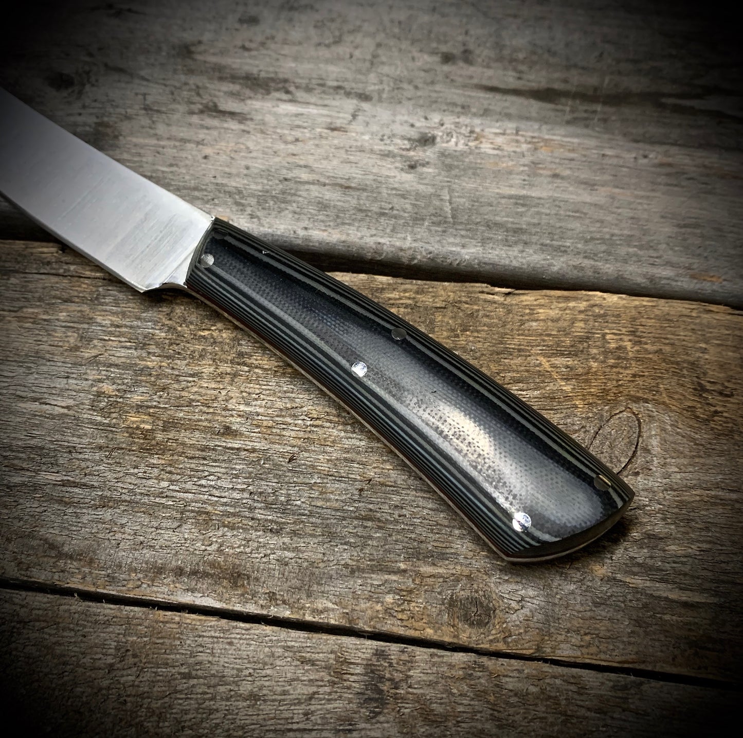 Hand Forged 1095  High Carbon Steel Hunting Knife, handmade in Winnipeg Canada by Blacksmith Graeson Fehr. Kydex or hand tooled leather sheath options.